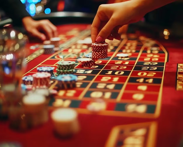 Live dealer dealing cards in Lightning Baccarat